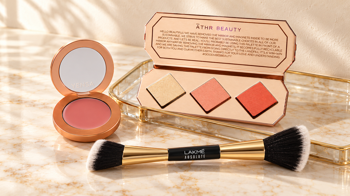 YENSA Moody Mauve blush, ĀTHR Beauty Amber cheek palette, and a Lakmé dual-ended brush on an ivory marble vanity.