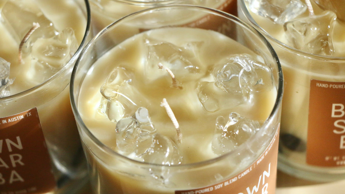 Glass jar candle with pale cream wax and floating ice-like pieces, Brown Sugar Boba label