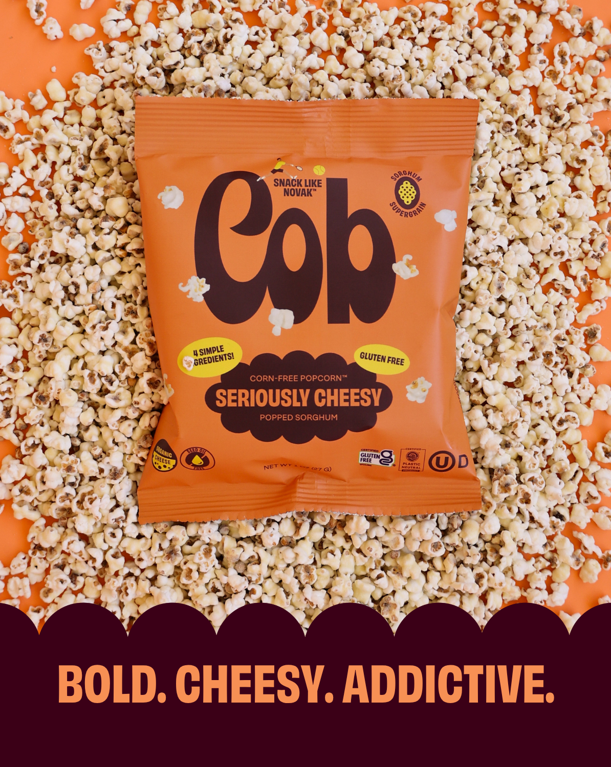 Orange popcorn snack bag with bold brand logo and “Seriously Cheesy” label