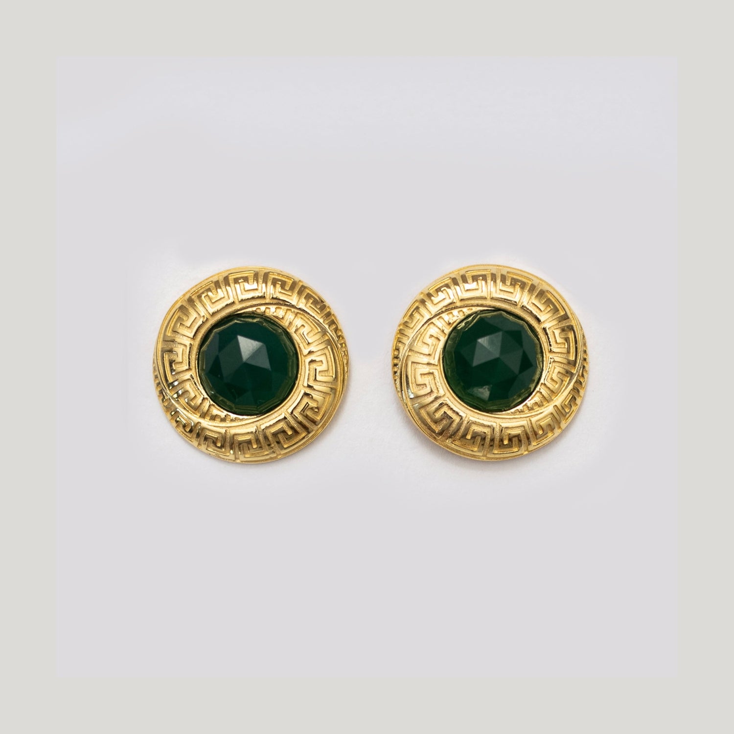 Gold-tone stud earrings with round green emerald gemstones