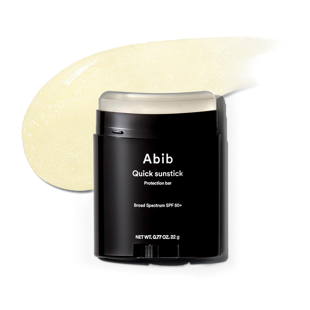 Abib Quick Sunstick protection bar SPF50+ in black container with cream balm swatch