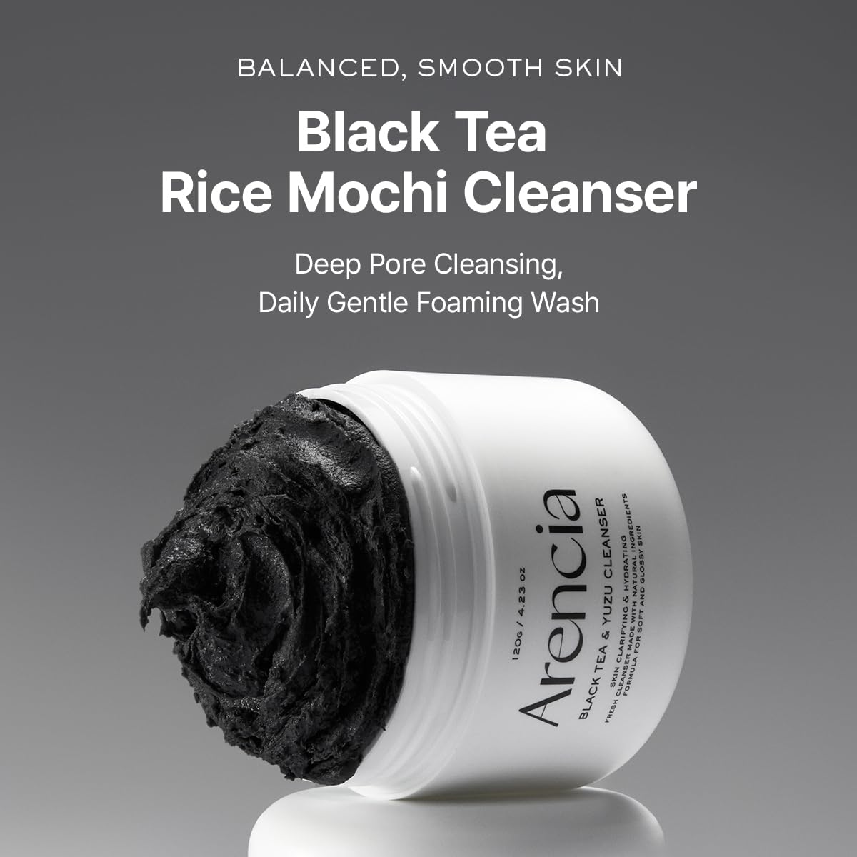 Arencia Black Tea Rice Mochi cleanser jar with black cleansing paste scoop
