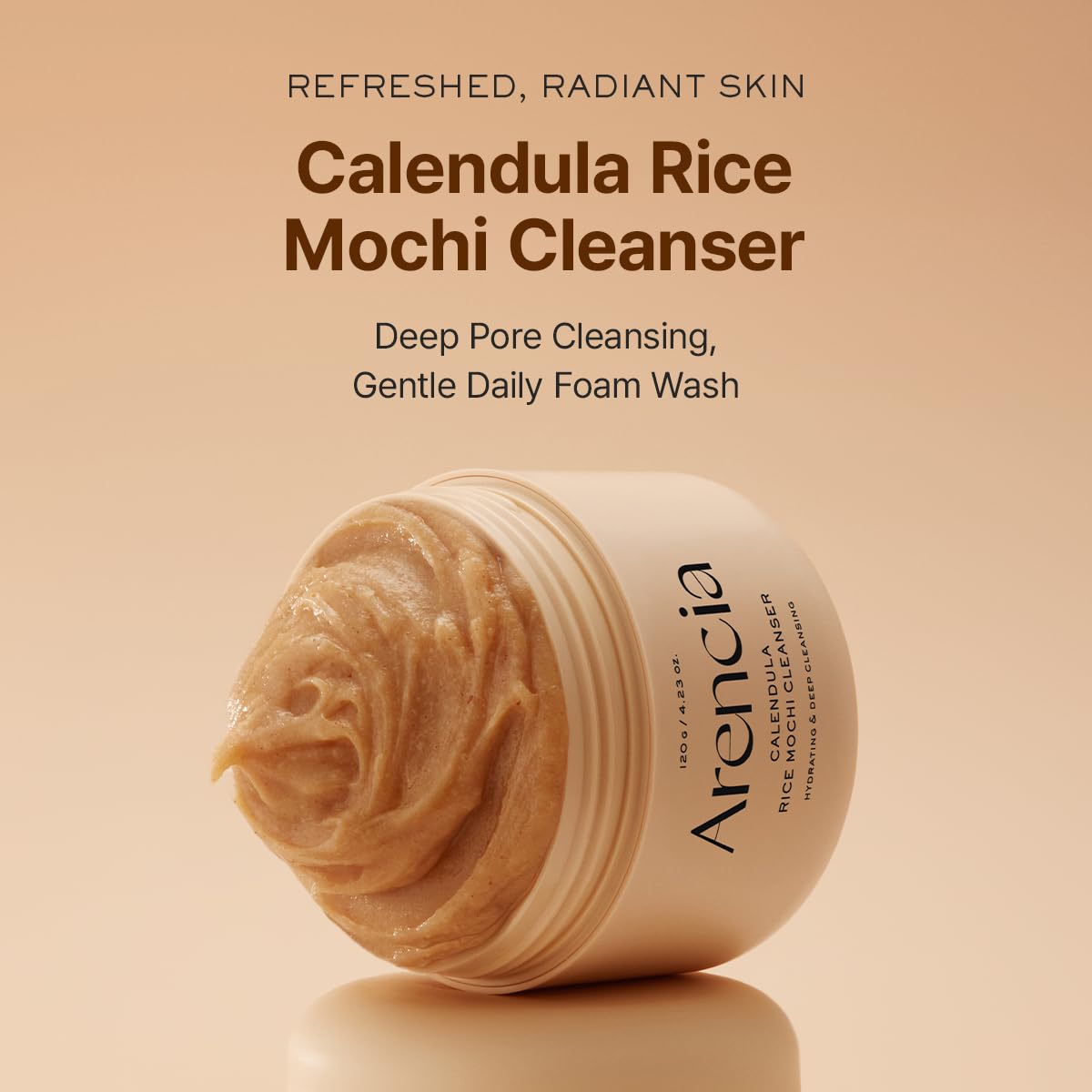 Arencia Calendula Rice Mochi cleanser jar, beige product with ridged lid, angled view