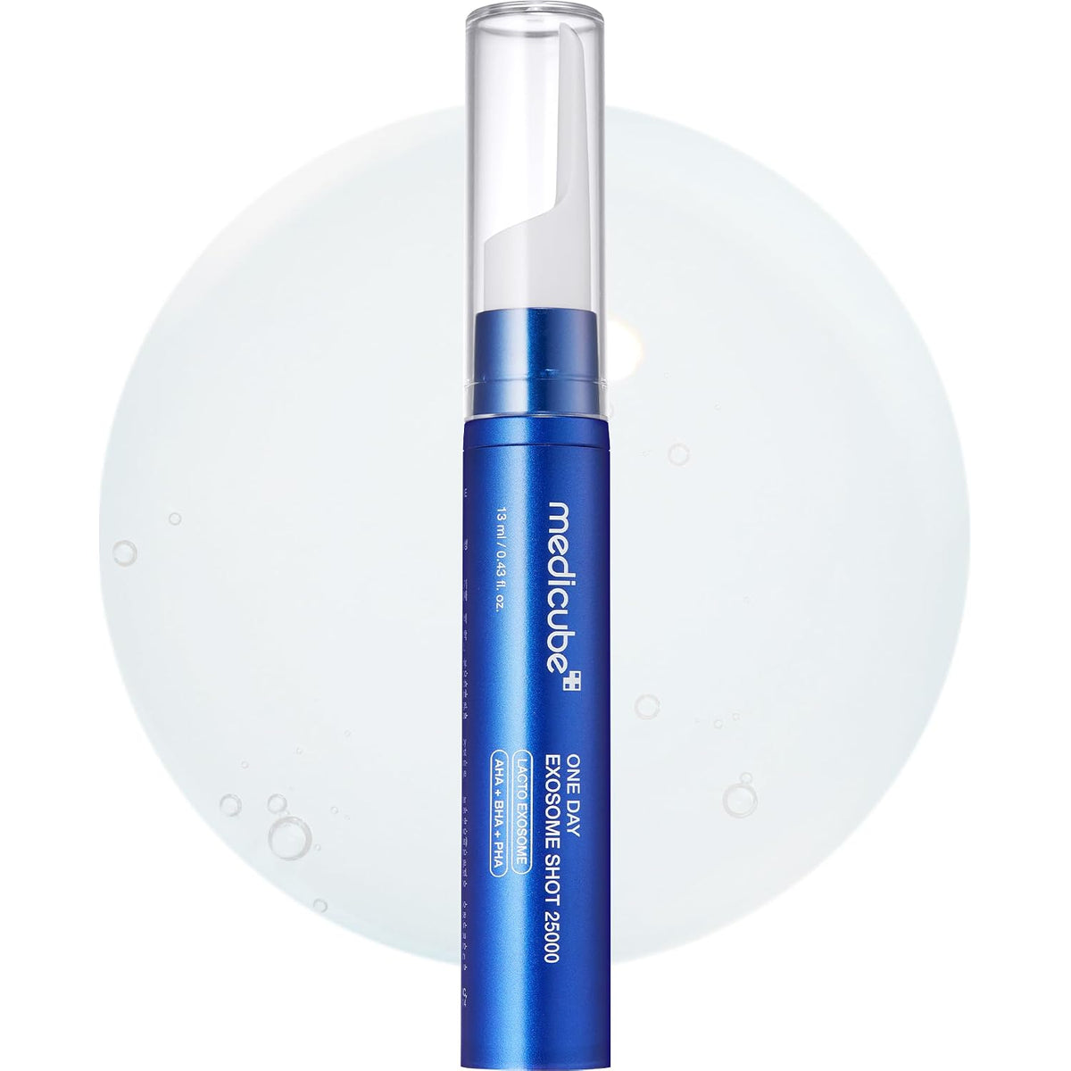 Blue skincare serum in clear pump bottle with Medicube label and applicator tip