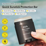 Abib Quick Sunstick protection bar SPF50+ black container with cap partly open