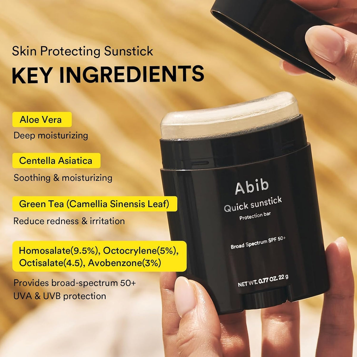 Abib Quick Sunstick protection bar SPF50+ held in hand with ingredient callouts