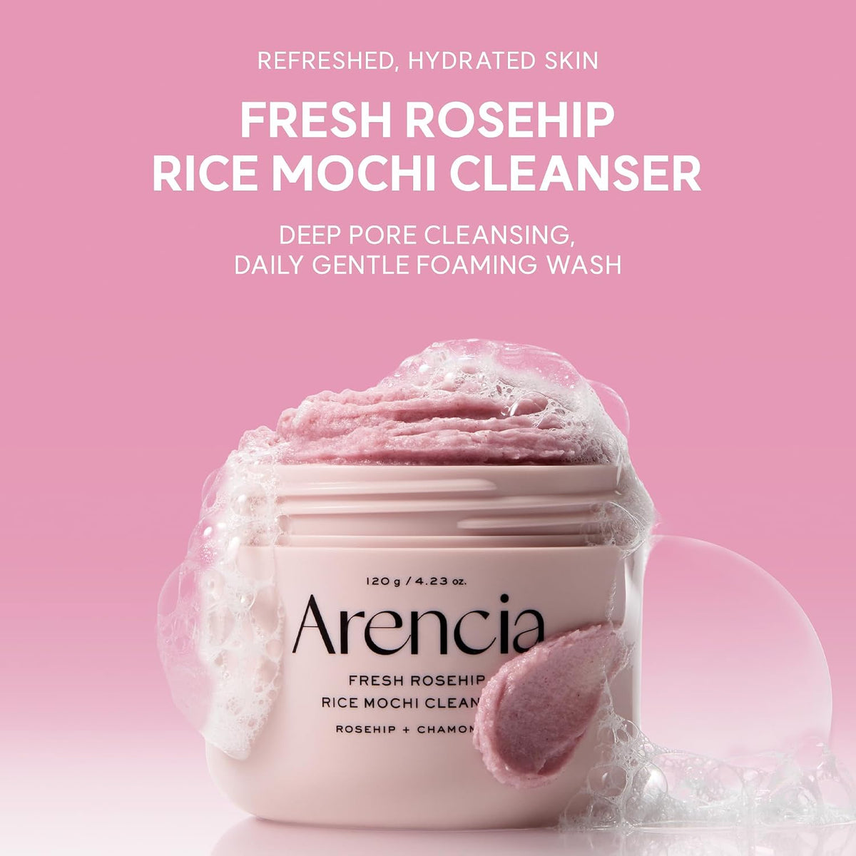 Pink cleansing jar with soft foamy rose-colored texture on top