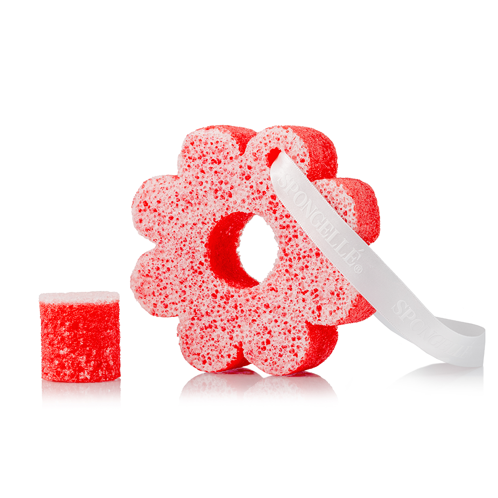 Red flower-shaped body wash sponge buffer with matching small block sponge piece.