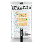 TRUBAR birthday cake flavored protein bar in white polka-dot packaging, 12g protein