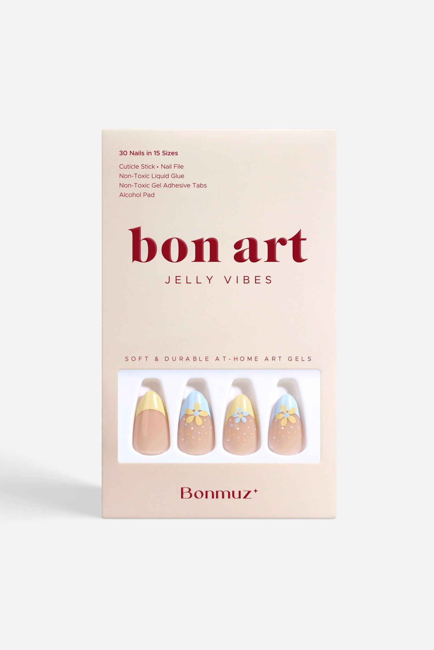 Press-on nail kit box with pastel blue, nude, and flower designs