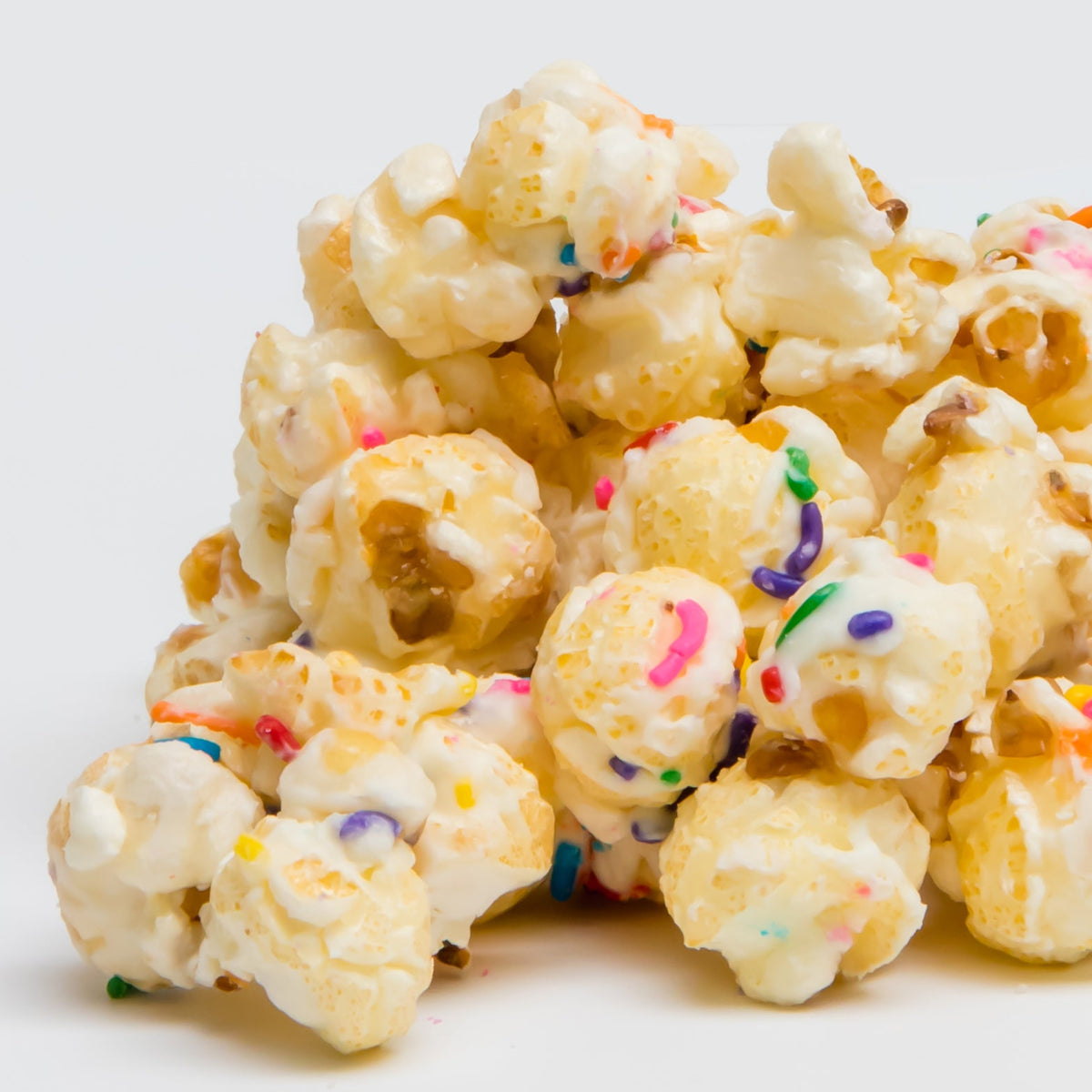 Creamy white popcorn clusters with rainbow sprinkle confetti