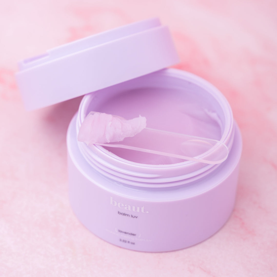 beaut. balm luv jar with open lid, purple balm gel inside