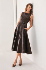 Dark brown faux leather midi dress, sleeveless with belted waist and A-line skirt.