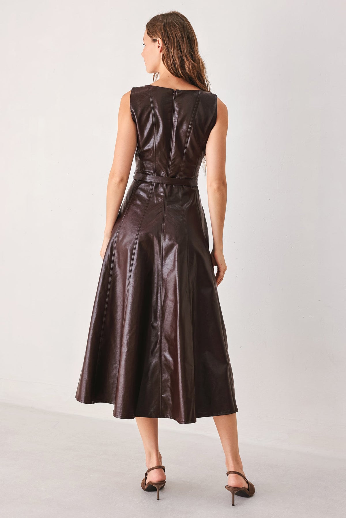 Dark brown faux leather midi dress back view, sleeveless and belted waist.