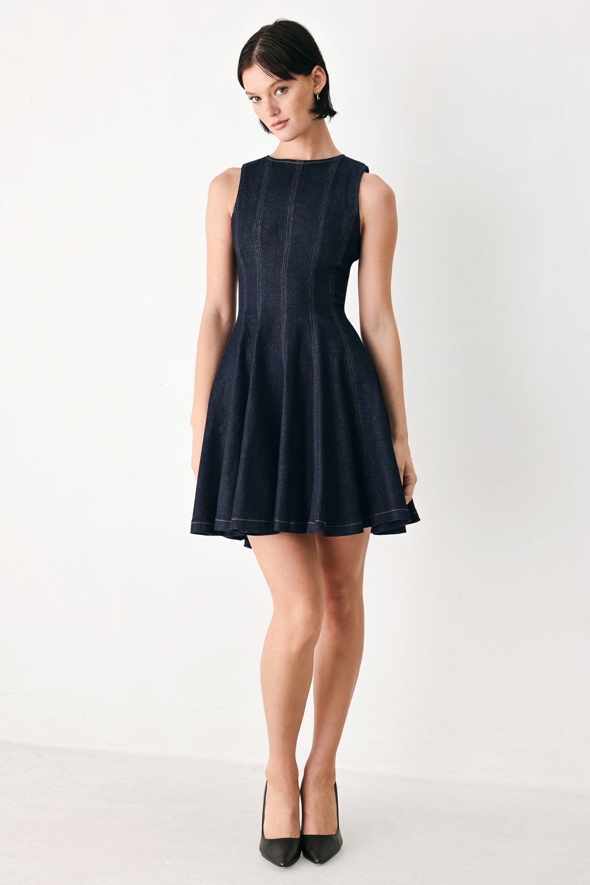 Dark denim sleeveless ballet mini dress with high neck and A-line flared skirt