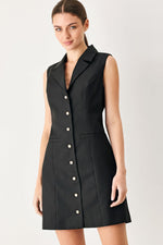Black sleeveless woven mini dress with point collar, patch pockets, gold button front
