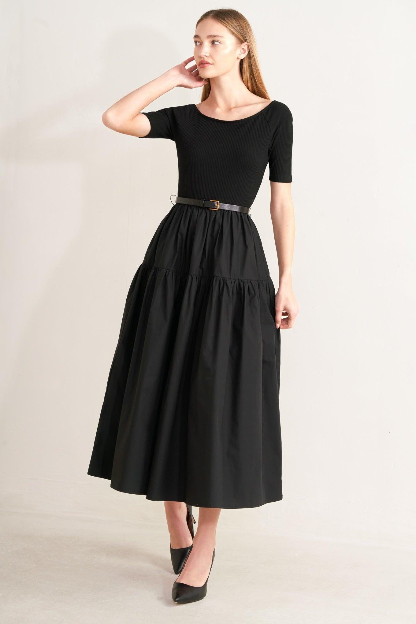 Black midi dress with short sleeves, scoop neck, and tiered skirt with waist belt