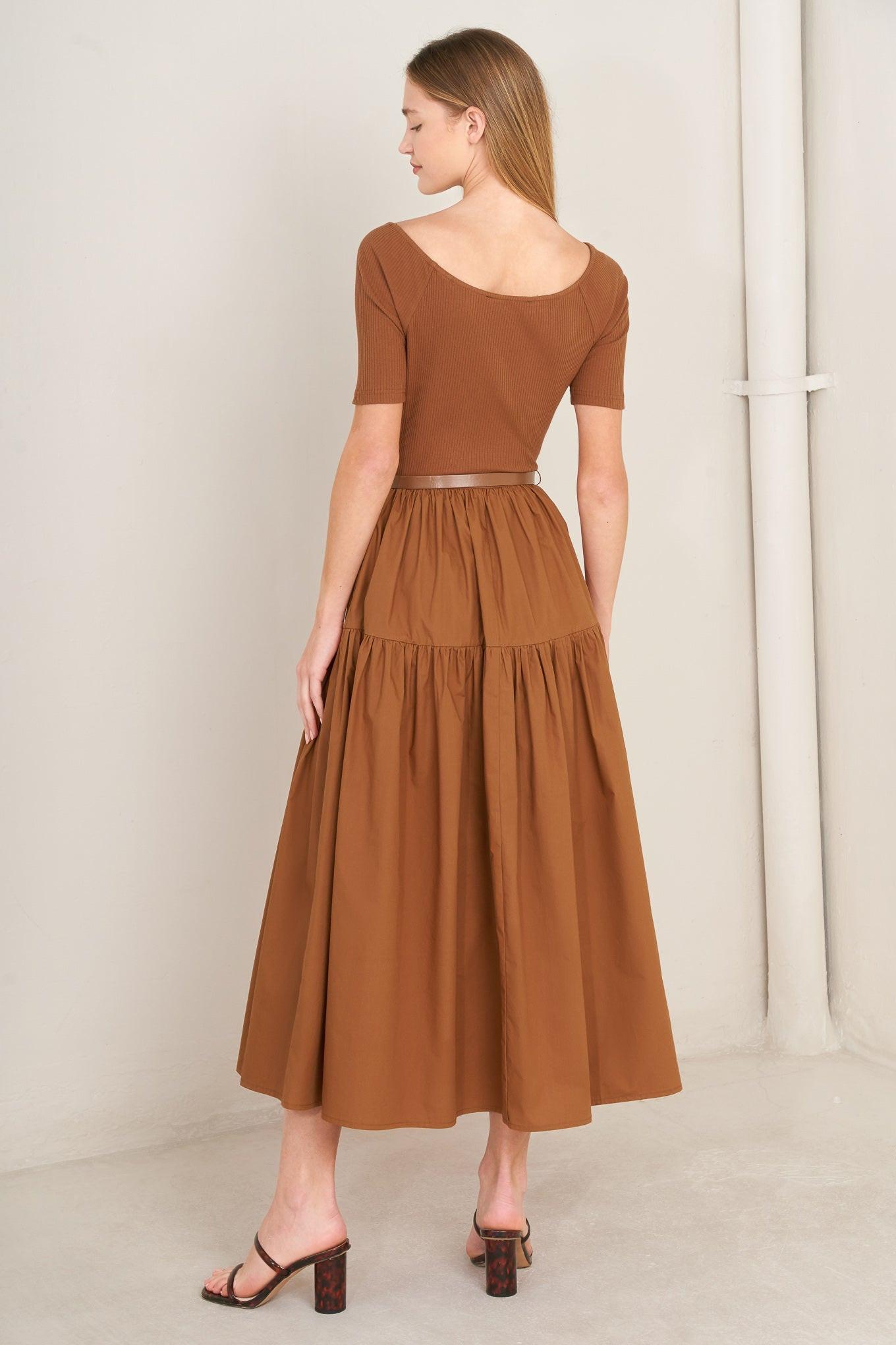 Rust midi dress from back with short sleeves, tiered skirt, and waist belt