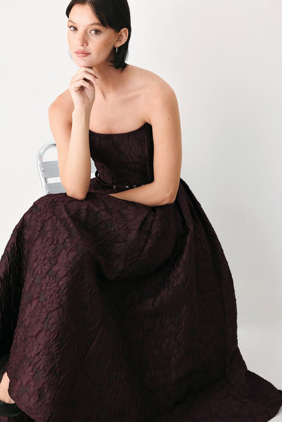 Burgundy strapless woven midi dress with corset bodice and flared skirt
