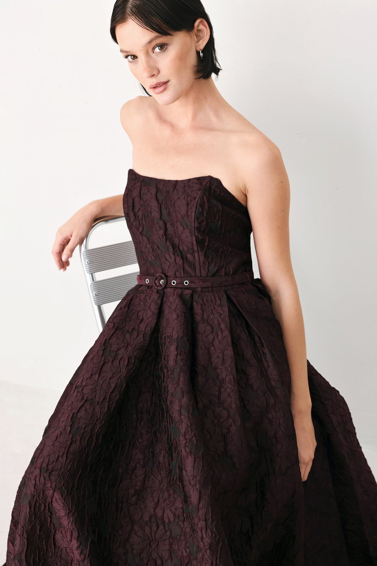 Burgundy strapless woven midi dress with corset top and buckled belt