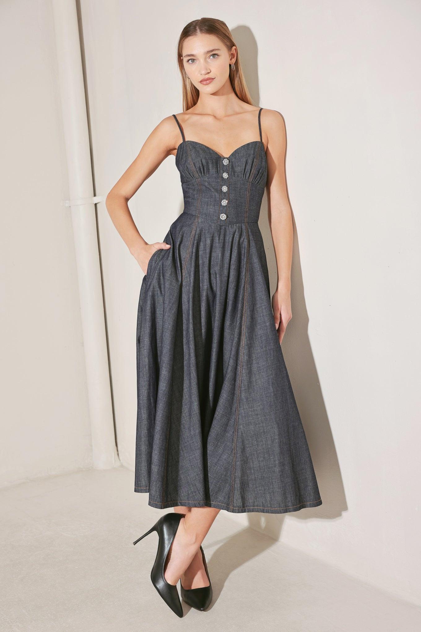 Dark denim midi dress with spaghetti straps, button front, and gathered skirt