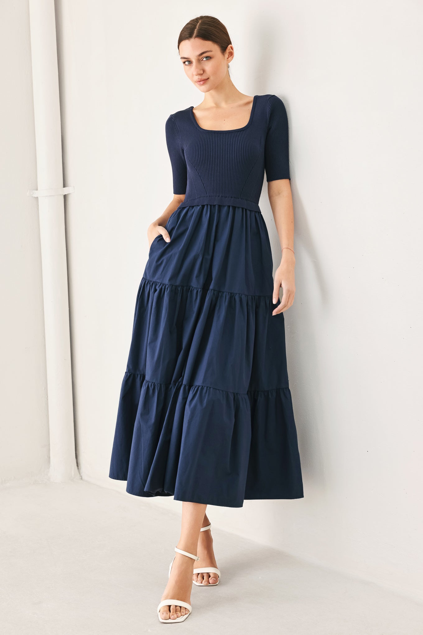 Navy knit midi dress with scoop neckline, short sleeves, tiered skirt