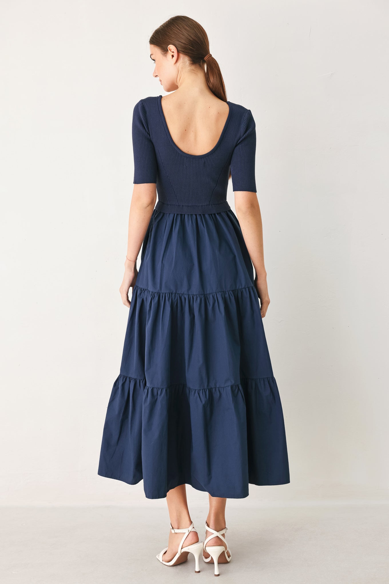 Navy knit midi dress with scoop back, short sleeves, tiered skirt