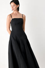 Black midi dress with thin straps, fitted bodice, full flared skirt