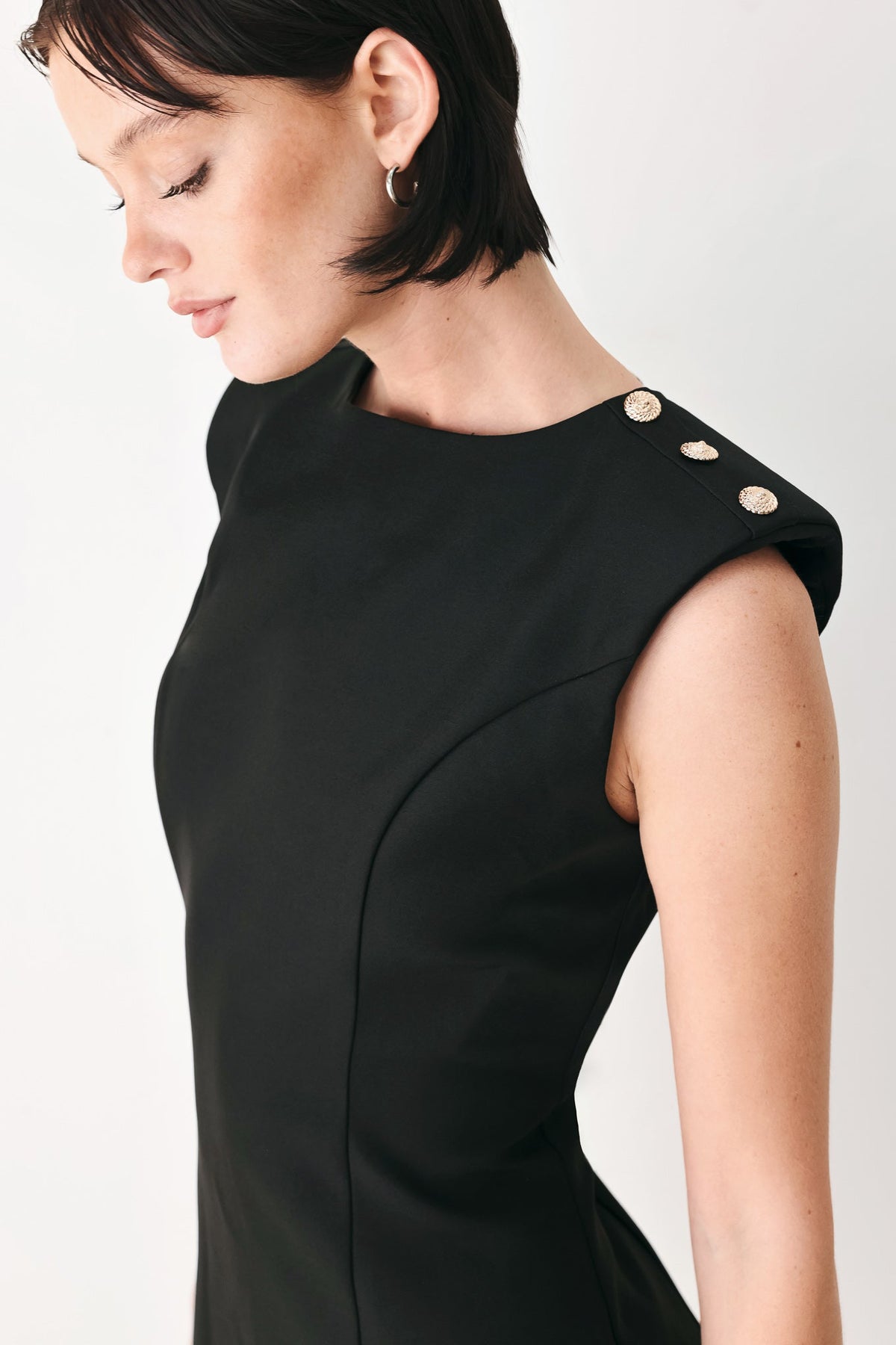 Black sleeveless mini shift dress with buttoned shoulder detail