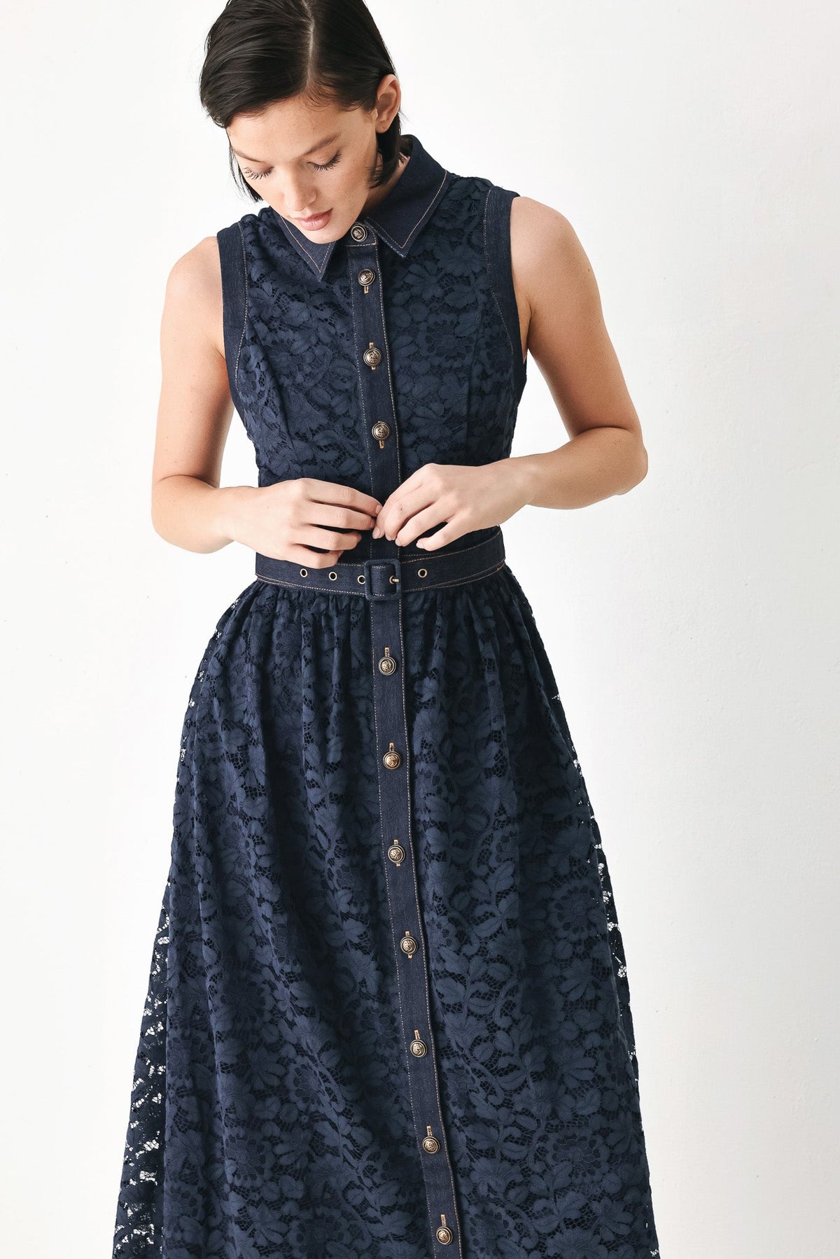 Navy sleeveless lace midi dress with front buttons and dark waist belt