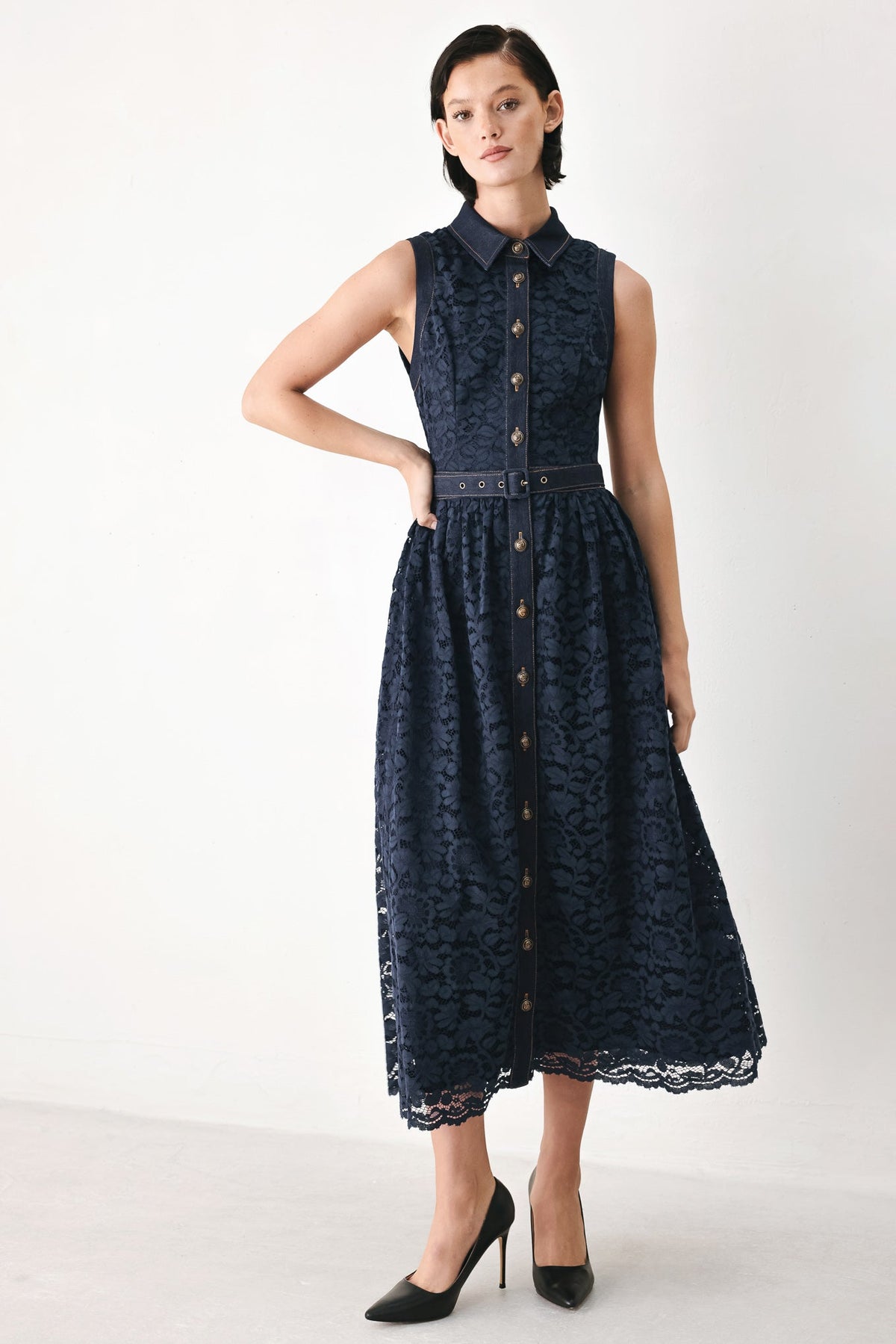 Navy sleeveless lace midi dress with high collar, button front, belted waist