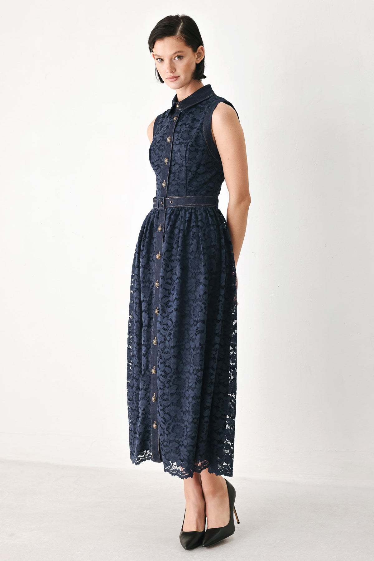 Navy sleeveless lace midi dress with high collar and buttoned bodice, belted waist