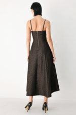 Dark patterned midi dress with spaghetti straps, back view of buttoned bodice