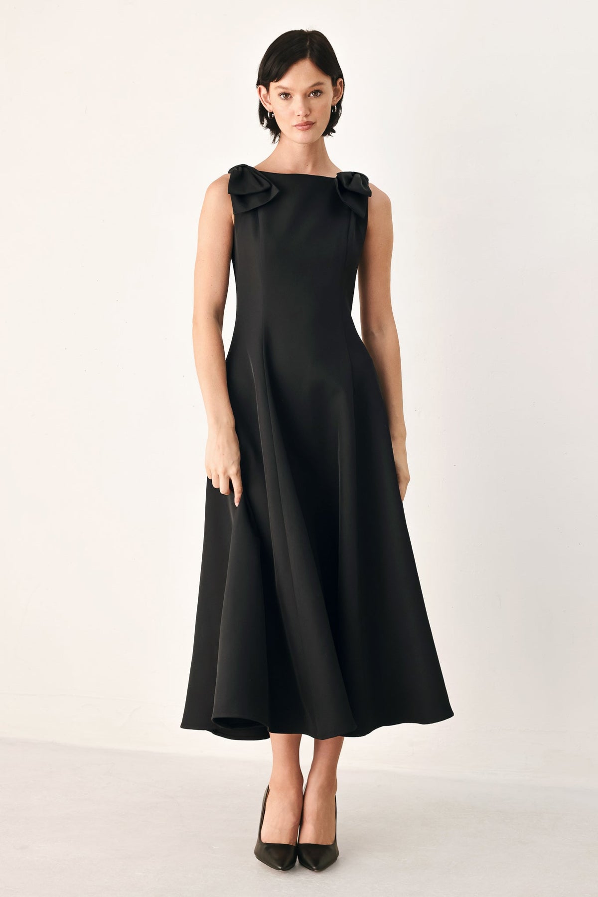 Black bow-shoulder midi dress with sleeveless bodice and A-line skirt