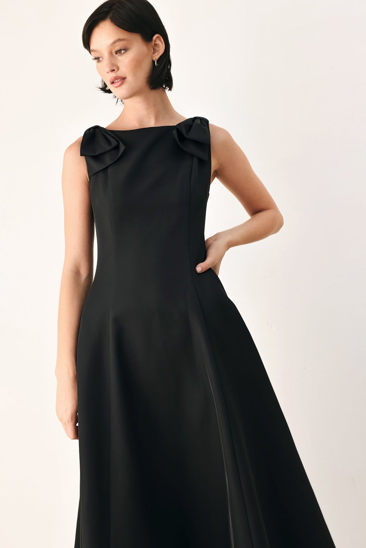 Black bow-shoulder midi dress, draped neckline detail and fitted waist