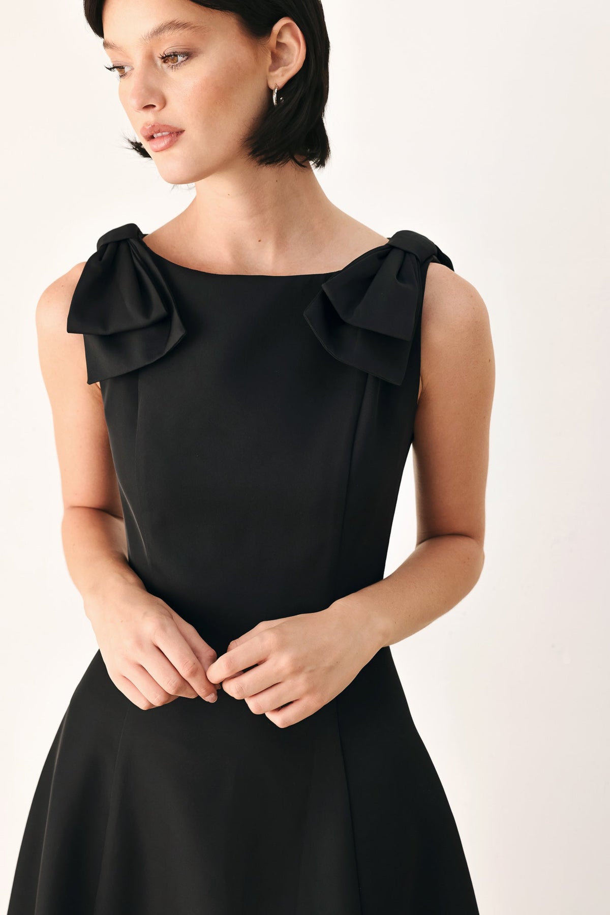 Black bow-shoulder midi dress, layered ruffle straps at neckline