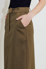 Woven skirt in olive brown with belt loops, front pockets, and buttoned waistband