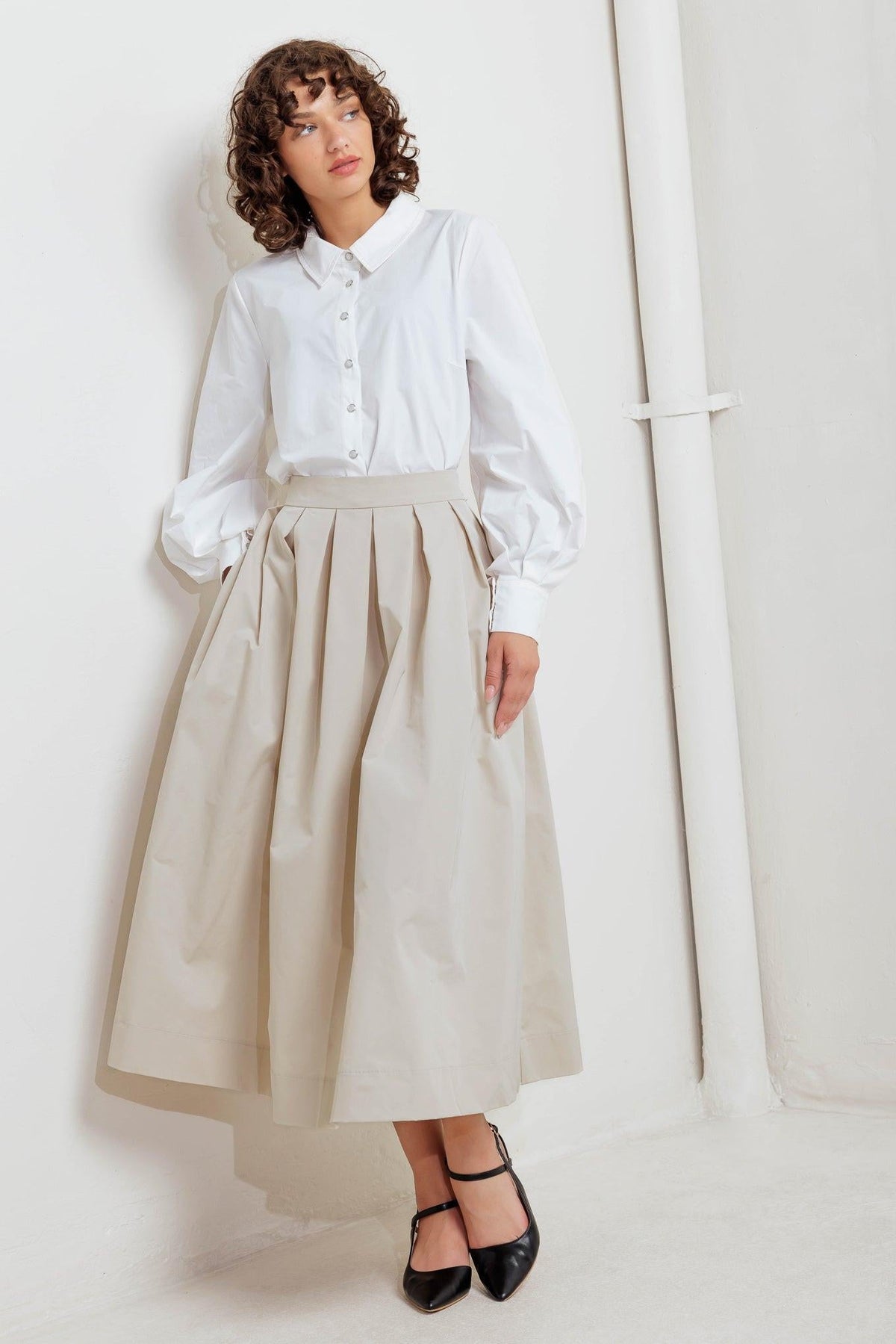 Cream midi woven skirt with roomy pleats and structured waistband