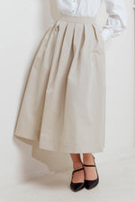 Cream woven full midi skirt with pleated panels and waistband at the waist