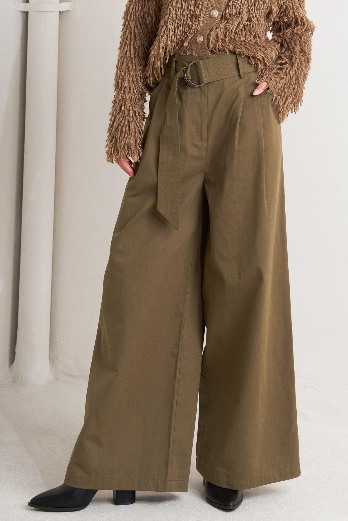 Dark olive woven wide-leg pants with self belt and visible side pockets