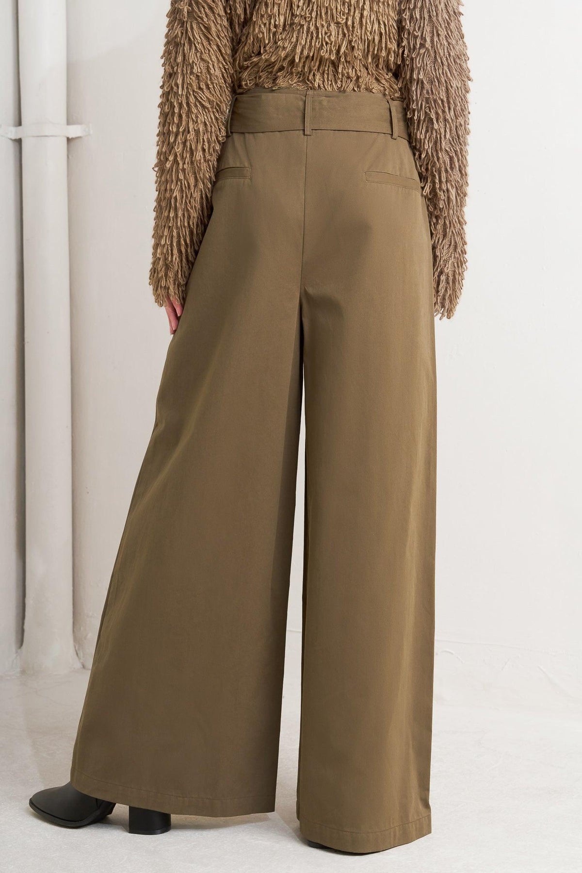 Brown woven wide-leg pants with high waistband and belt loops