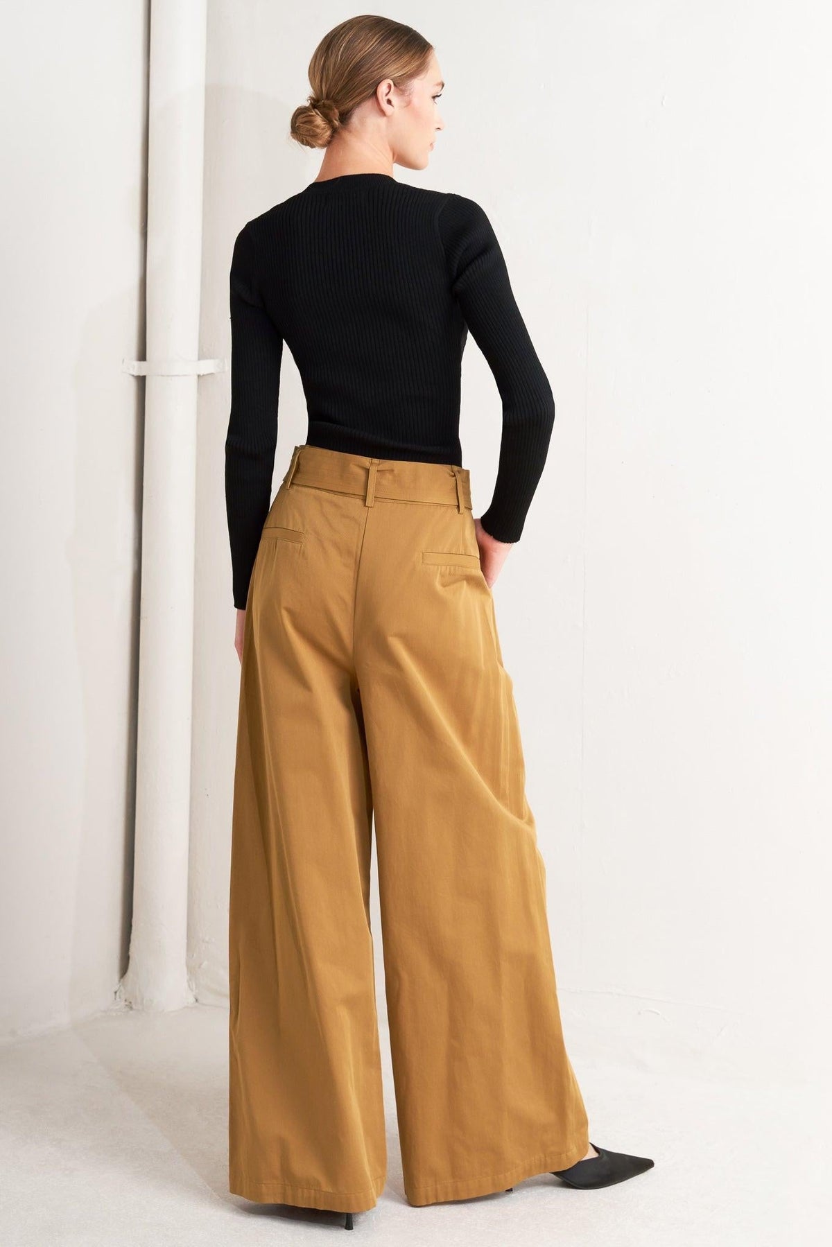 Camel woven wide-leg pants from back view with back yoke seam and pockets