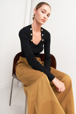 Camel woven wide-leg pants with belt at waist and structured pleats