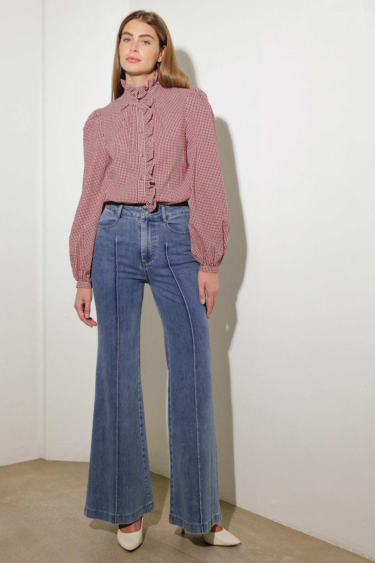 Medium wash stretch denim flared jeans, high rise waist, five-pocket styling, belt loops