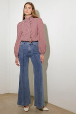 Medium wash stretch denim flared jeans, high rise waist, five-pocket styling, belt loops