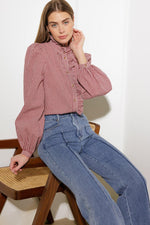 Medium wash stretch denim wide-leg jeans with front pockets and high-rise waistband