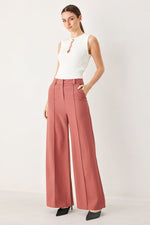 Dried rose woven wide-leg pants with high waist, center crease, belt loops, side pockets.
