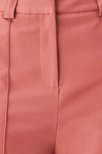 Rose woven pants close-up of front vertical seams and waistband finish