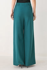 Teal woven wide-leg pants with high waist and belt loops, straight draped legs.