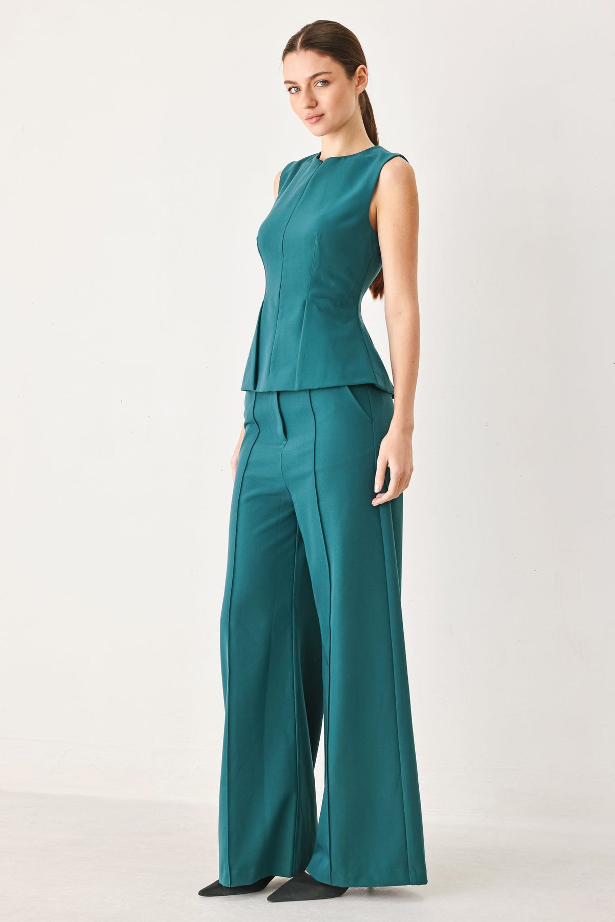 Teal wide-leg woven pants with high waist, front crease, belt loops, side pockets.